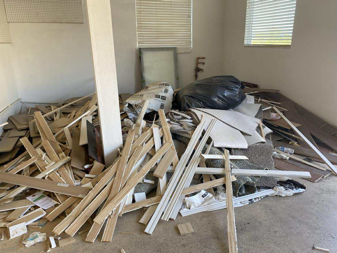 Office cleanout with furniture and equipment ready for removal