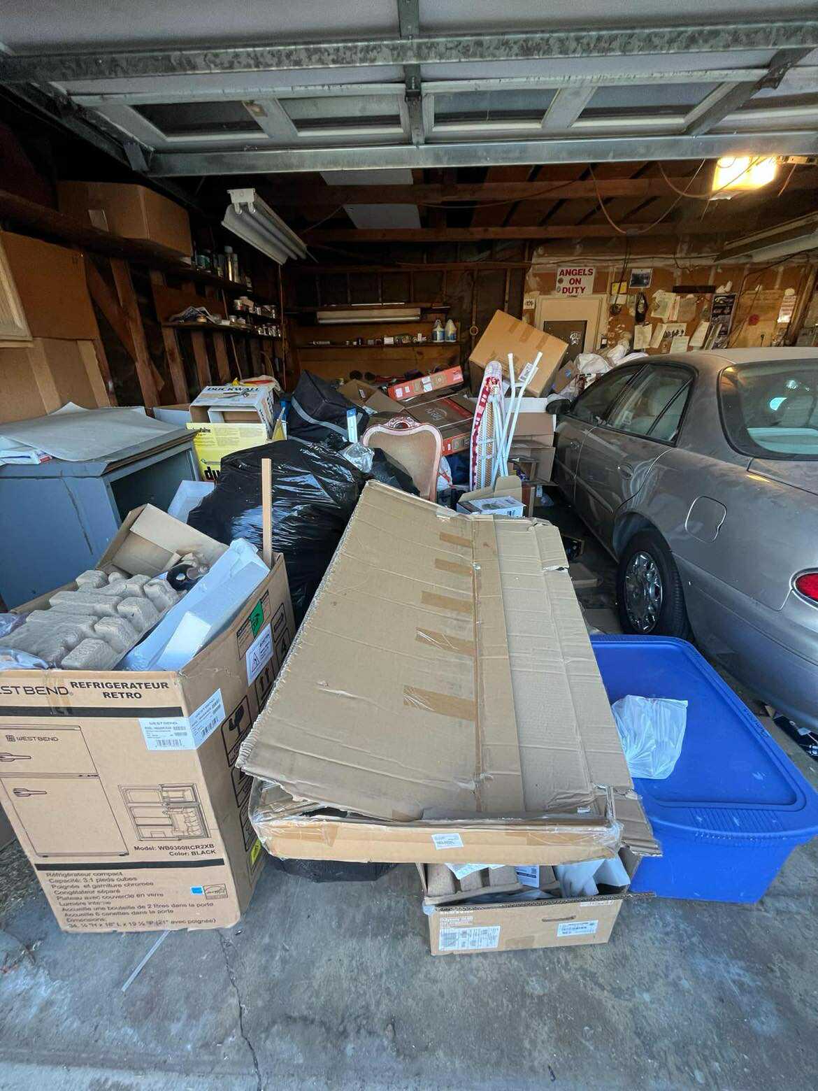 Cluttered garage before professional cleanout service in Murrieta